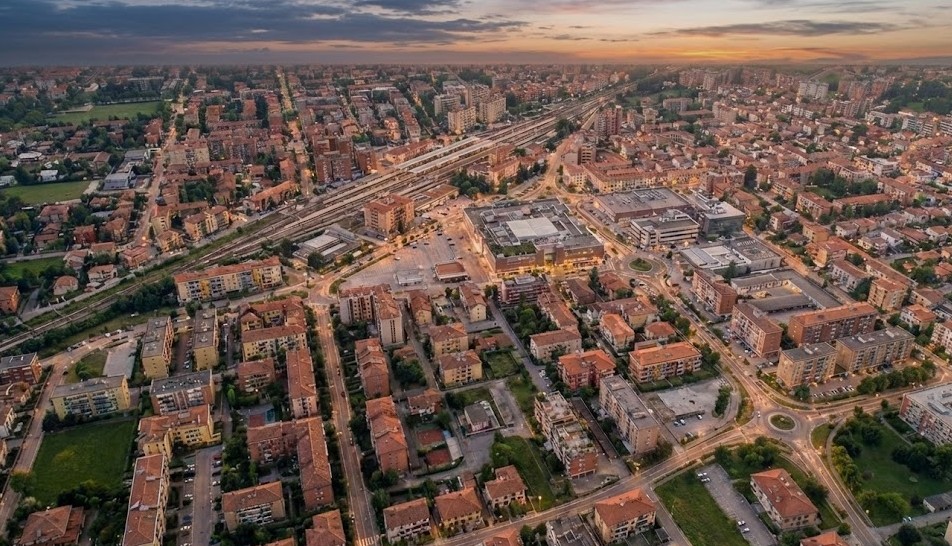 Aerial urban view of Mestre, Italy, showing the railway lines and city grid at sunset